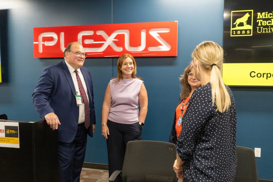 David Lawrence, Lori Ney (second from left), and Talent Management Operations Manager Kim Cannon mingle. With her back to the camera is Brittany Selner, manager of Communications and Community Engagement.