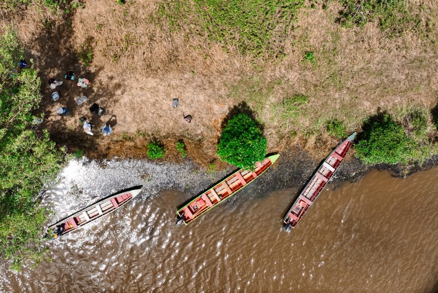 A drone, an important tool of geographic information science, captured this picture of boats and students in Suriname.