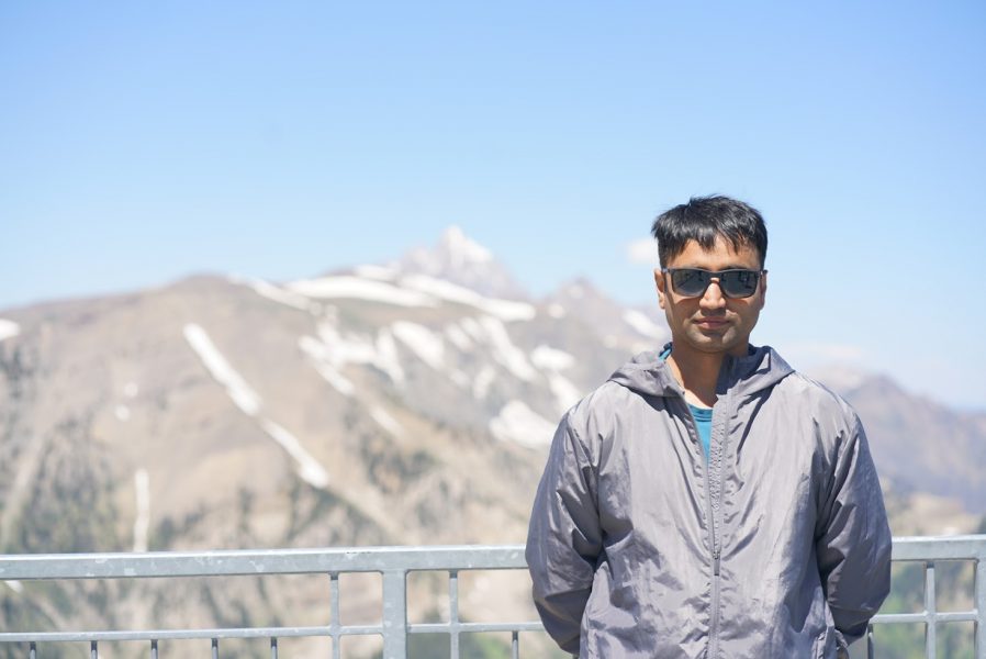 Abhishek Patil standing in front of mountains