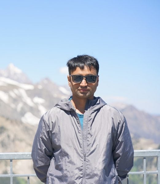 Abhishek Patil standing in front of mountains