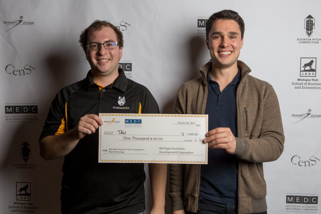 Kyle Ludwig and Adam Weber accepting their check for Best Technology at the Bob Mark Elevator Pitch Competition.