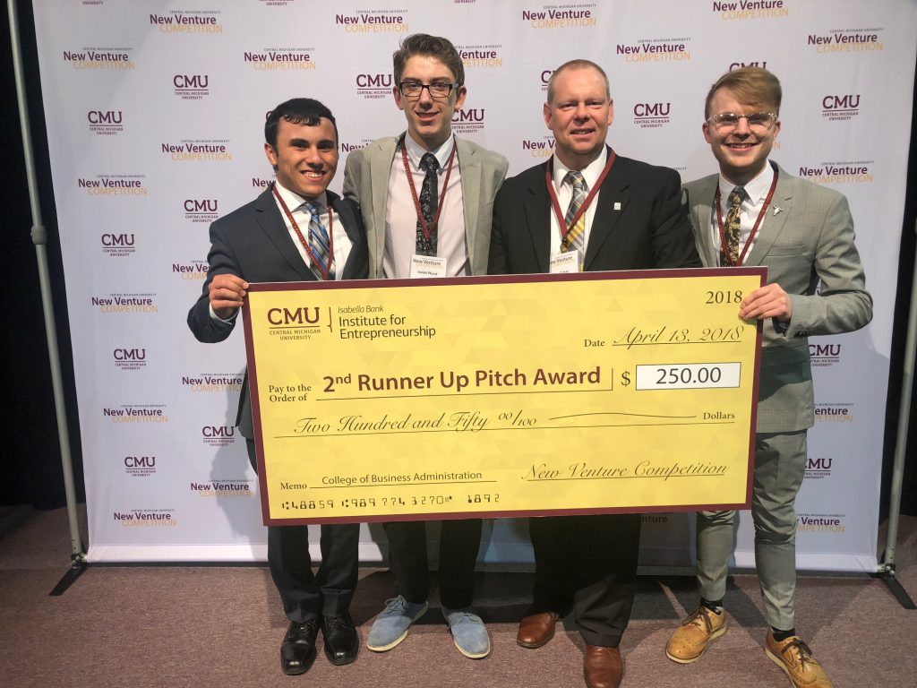 From left to right, Sheahan, Pfund, Baker (mentor), and Horrigan accept award check