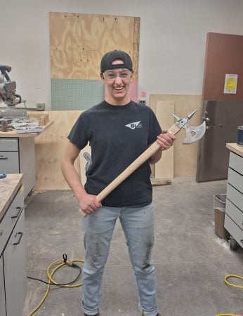 Elizabeth holding an axe