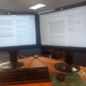 Computer screens with text documents open