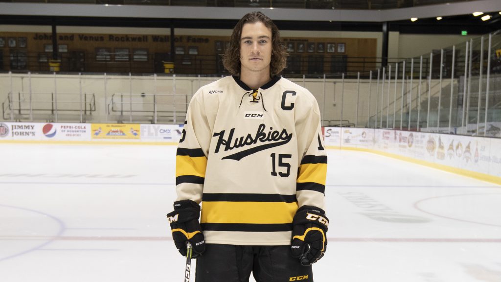 Jake Lucchini stands on the ice in hockey gear