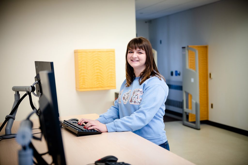 Brook Greening, a college student, works at a computer