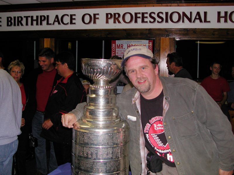 Larry Sutter in the Michigan Tech SDC with the Stanley Cup