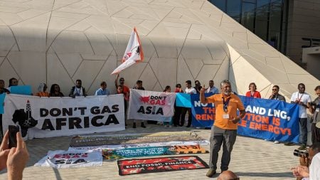 Demonstration with banners like "Don't Gas Africa" and "Don't Gas Asia"