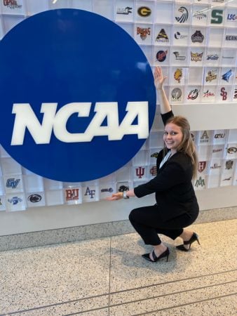Jamie Dompier with a giant NCAA logo