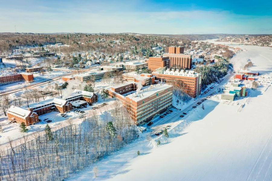 Aerial view of campus and the Portage Canal in winter.