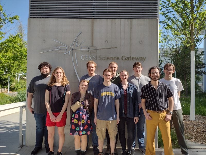 Students pose at entry to CERN