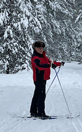 Professor Stacewicz skiing through a winter scene.