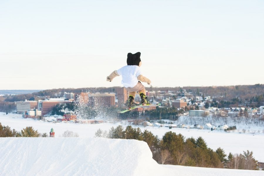 Blizzard skiing off a ski jump