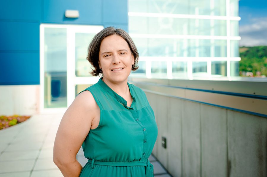 Amy Marcarelli stands outdoors at the Great Lakes Research Center on a sunny day.