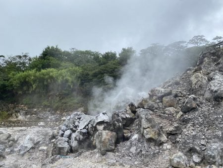 Hot spring in Costa Rica with steam rising.