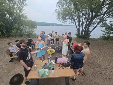 A diverse group of students smiling at Princes Point.