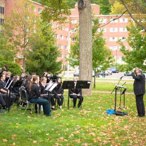 Image of Superior Wind Symphony performing outdoors on the Walker Lawn