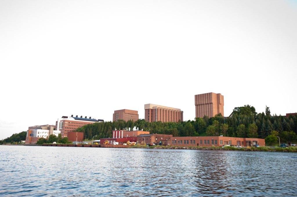 A view of campus from across the waterway.