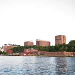 A view of campus from across the waterway.